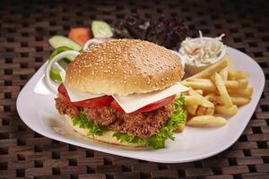 Chicken Fillet Sandwich or burger with fries and salad served in dish isolated on table side view of middle east food photo