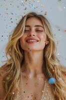 Woman in Silver Dress Surrounded by Confetti photo