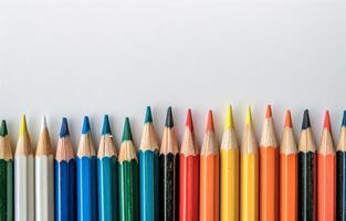 Row of Colored Pencils Against White Background photo