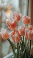 Pink Flowers in Vase on Window Sill photo