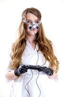 Real dental doctor holds the medical glasses with binocular lenses, in dentistry clinic. Dentist glasses or dental optic on a hospital medical laboratory. Modern technology equipment in surgery room. photo