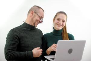 adult man flirting with girl smiling flirting prank joke embarrassment man trying to like man with glasses on nose looking at a monitor on a computer an interesting dating device on an airplane photo