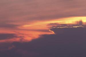 Golden Sunset with Silhouetted Clouds photo