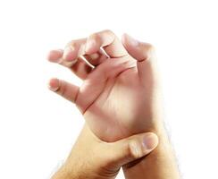 Man holding his painful wrist photo