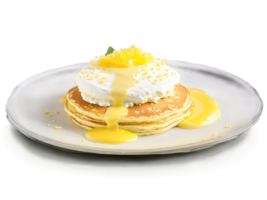 Pancakes ricotta and lemon with a dollop of lemon curd on a transparent glass plate png