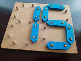 Wooden Digital Numbers. Kid toy creative wooden for mathematics learning photo