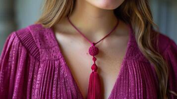 Woman Wearing Red Necklace With Tassel photo