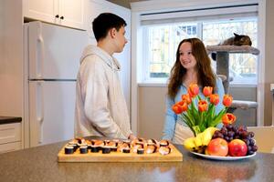 the girl came to visit a friend the first date the guy prepared fruits and flowers as a gift food delivery attitude teenagers photo