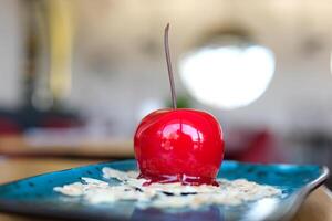 appetizing sweet piece of cake on a plate is eaten with a spoon. selective focus. sweet dessert for breakfast. cake with icing and decorated with berries photo