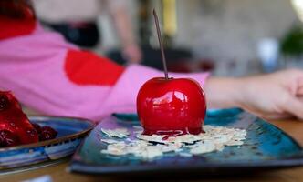 appetizing sweet piece of cake on a plate is eaten with a spoon. selective focus. sweet dessert for breakfast. cake with icing and decorated with berries photo