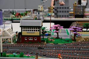 Canada Vancouver 05.17.2024 cloverdale rodeo and country fair Lego blocks houses cars streets trains trams. Real life of Lego toys close-up footage of railways in a huge city made of blocks photo