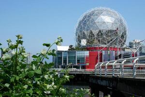 skyray station on Main street Science Word with the world of science for children museum Big Globe ball sphere on a blue clear sky panorama Canada Vancouver photo