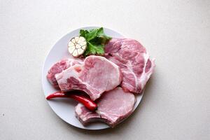 Set of various classic, alternative raw meat, veal beef steaks chateau mignon, t-bone, tomahawk, striploin, tenderloin, new york steak. Flat lay top view on white table background photo