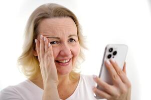 shy conversation over phone Photo of charming lovely lady short hairstyle hands hold telephone shy dirty joke sincere smile share post like feed wear green shirt isolated white background