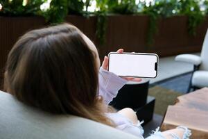 cell phone blank white screen mockup.hand holding texting using mobile on desk at office.background empty space for advertise.work people contact marketing business,technology photo