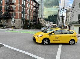 Vancouver, British Columbia, Canada 2023 Taxi cabs bringing thousands of tourists to Vancouver's cruise terminal. taxi ride photo