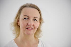 Studio portrait of middle aged business woman. photo