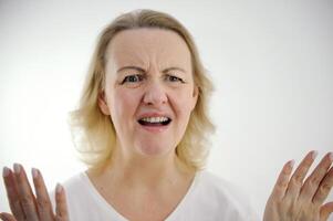 white background disgruntled woman raised Hands Up Seriously mouth is open press forehead furrowed eyebrows and anger of despair frustration on face unjustified hopes bad product unpleasant emotions photo