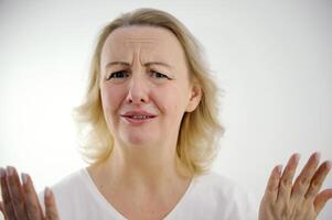 woman frustrated surprised surprised angry sad starts to cry sadness dissatisfaction bad service angry customer upset patient wrinkled forehead frown eyebrows despair white background space for text photo