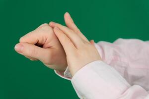 Caring comforting hands expression of emotions with hands unrecognizable people hands palms fingers close-up on a green background chromakey feelings photo