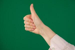 Thumb of man hand. Isolated expression of emotions with hands unrecognizable people hands palms fingers close-up on a green background chromakey feelings photo