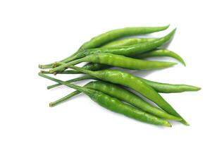 Green chillies isolated on white background. Concept, food ingredient for cooking. Spicy taste. Agriculture crops, organic vegetable has health benefits qualification. photo