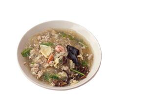 Clear vermicelli soup with minced pork, dried shrimp,mushroom, other ingredients in bowl, isolated on white background. Concept, Thai local cuisine food. Delicious menu with nutritious. Easy to cook. photo