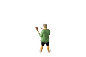 Miniature people , A young man with a BBQ Isolated on white background with clipping path photo