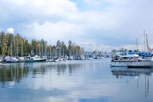 4k Beautiful harbour, port, marina, haven, sailing boats, yachts, blue water, lake, bay, trees, park, house, docks, calm, sunny day photo