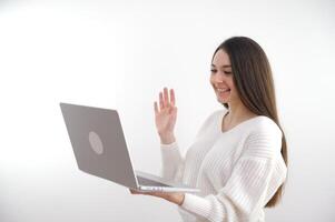 Photo of joyful happy positive mature woman wave hello computer online meeting indoors inside house home