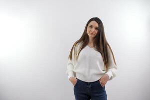 Image of an amazing young business woman standing isolated over grey wall background looking camera. photo