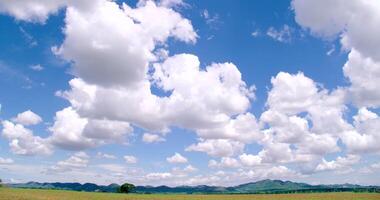 Timelapse of clouds with ground and mountains , at noon video