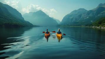 Couple kayaking on a serene lake with mountains in the background. video