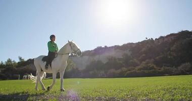 Harmony with Nature. Girl Riding Horse on Ranch, Lifestyle of Peaceful Horseback Rides in Picturesque Natural Settings, Love for Animals and Caring Happiness. High quality 4k footage video