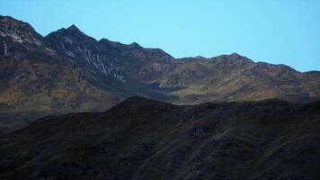 A mountain range with a blue sky in the background video