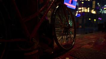 Bicycle Parked on Rainy Night in Bright Asian City video