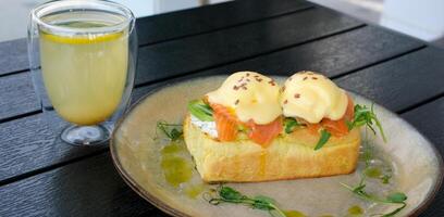 Eggs Benedict- toasted English muffins, poached eggs, and delicious buttery hollandaise sauce photo