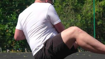 sports and leisure. strong Caucasian man working out using kettlebell in the park video