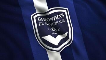 Close up of FC Girondins de Bordeaux flag, seamless loop. Motion. French professional football club emblem. For editorial use only. video