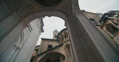 Discover the Cathedral of Santa Maria Maggiore in Bergamo, Italy. Historic Arches, Frescoes, and Mosaics in a European Urban Landscape. High quality 4k footage video