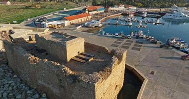 Aerial View of Ancient Castle Fort on the Mediterranean Coast in Paphos, Cypru. High quality 4k footage video