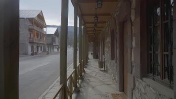 Ancient wooden city. ACTION. Wooden terrace made of wood on the street. Saloon in a warm country video