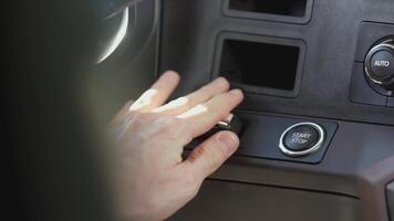 The key is in the ignition. SCENE. In a dark interior, a key is inserted into the car ignition. The car key is inserted next to the ignition button video