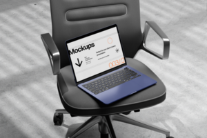 Notebook mockup and keyboard on the realistic chair with shadow psd