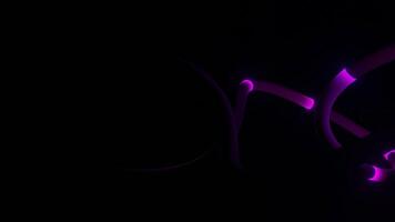 Abstract long bending tube like line with glowing lines flowing isolated on a black background, seamless loop. Design. 3D stripes with round moving lights. video