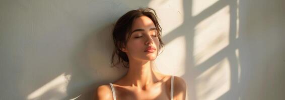 Woman Sitting on Floor With Eyes Closed photo