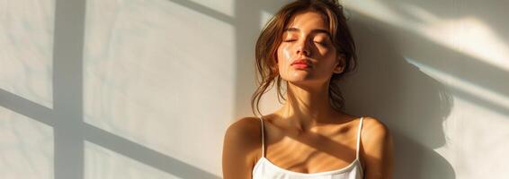 Woman Sitting on Floor With Eyes Closed photo