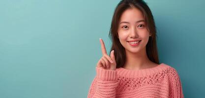 Woman in Pink Sweater Holding Up Peace Sign photo