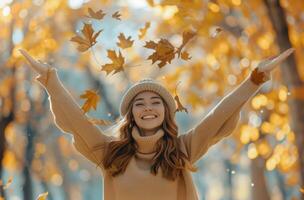 Woman With Hands Raised Surrounded by Leaves photo