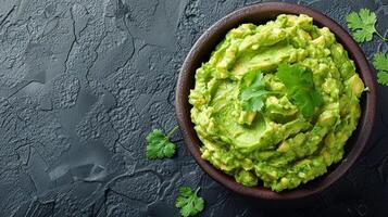 Bowl of Guacamole on Table photo